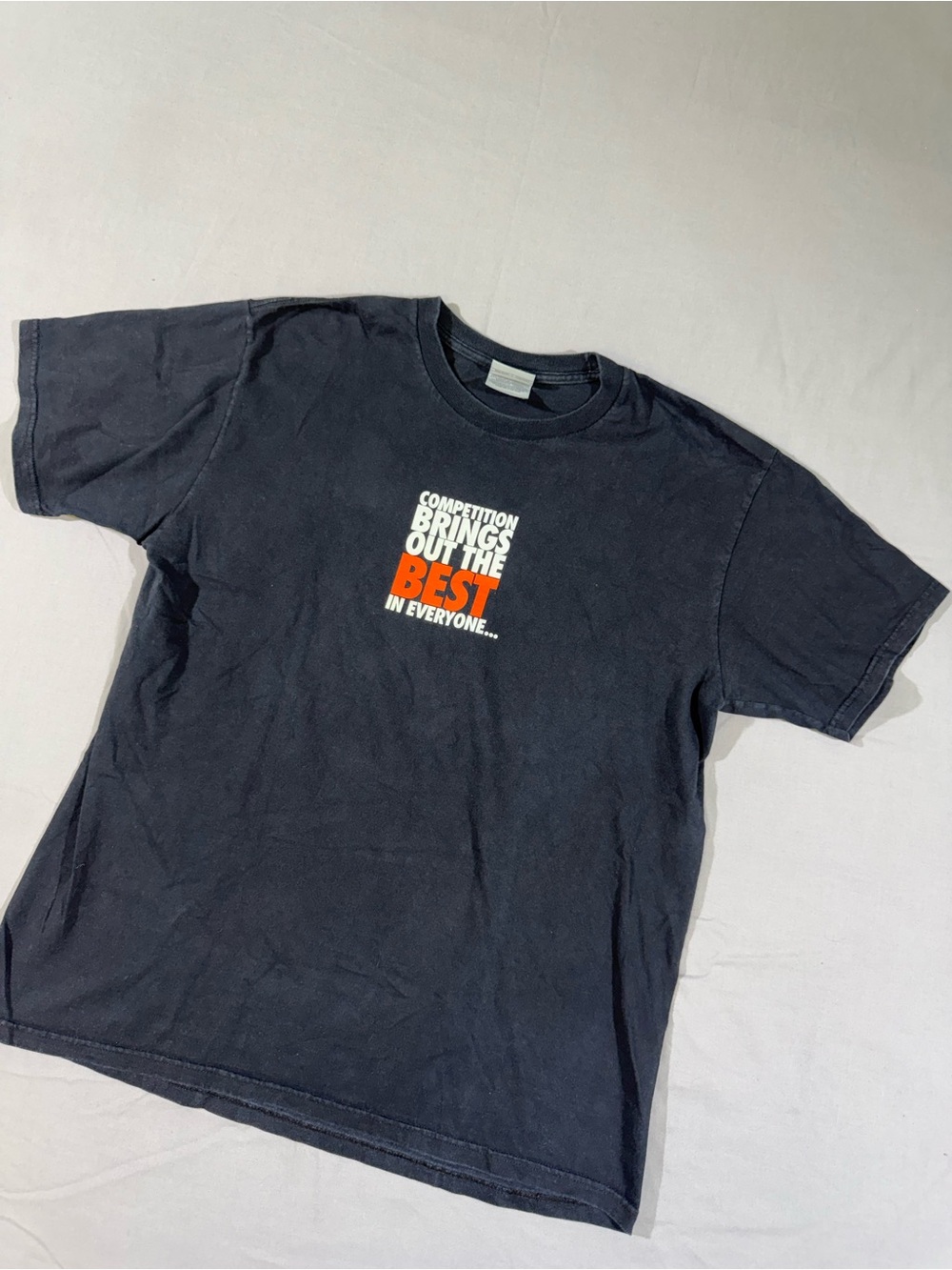 Vintage Nike “Competition Brings Out The Best In Everyone…” Graphic T-Shirt